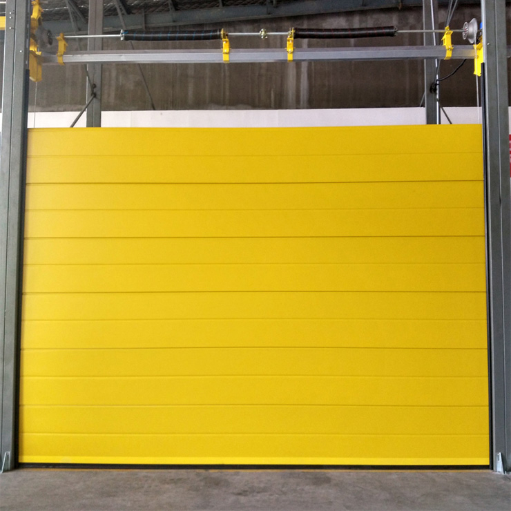 Yellow sectional industrial door
